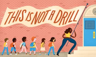 Illustration of a teacher wielding a "This Is Not A Drill" flag leading a line of students to a blue school door