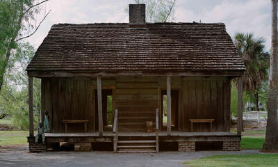 Photograph of an old cabin.