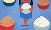A young girl with bowls full of food.