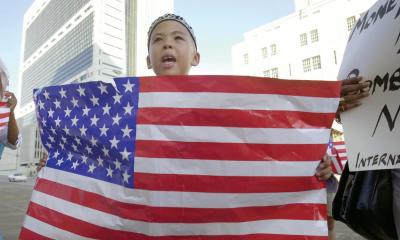 Student holding a US flag