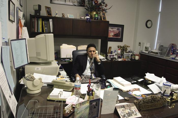 Principal Frank DeAngelis working at his office