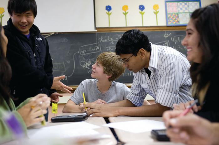 New Trier student David Walchak (center) was pne pf several members of the Illinois Council of Students who visited Lane Tech College Prep High School