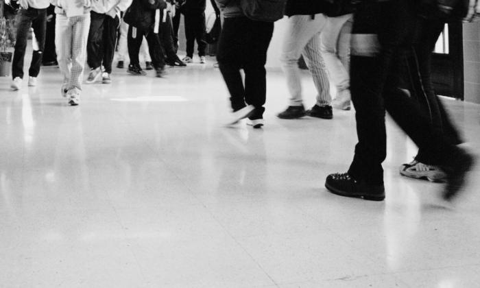 black and white legs walking in hallway