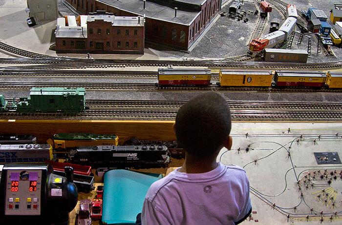 Boy watching the train exhibit