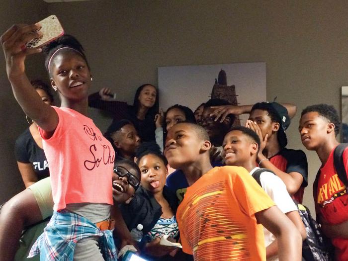 Kids take a selfie at the museum