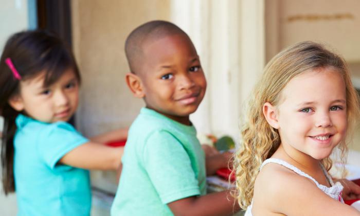 racially diverse group of children posing