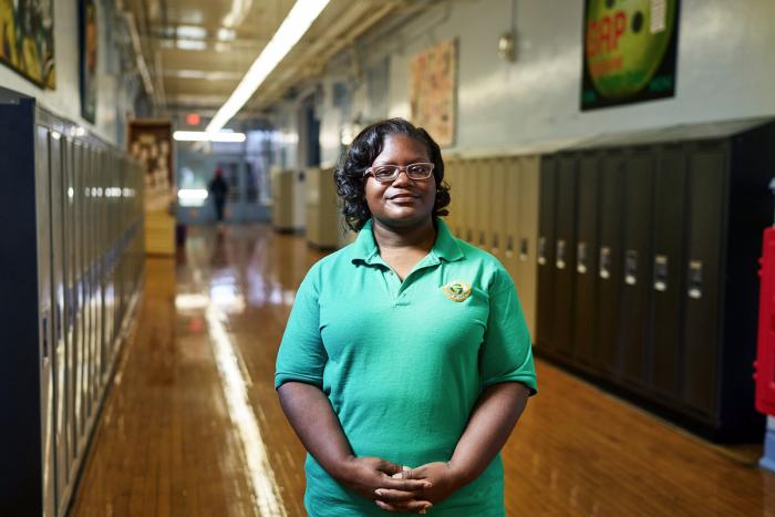 Educator LaKeshia Myers standing in the school hallway