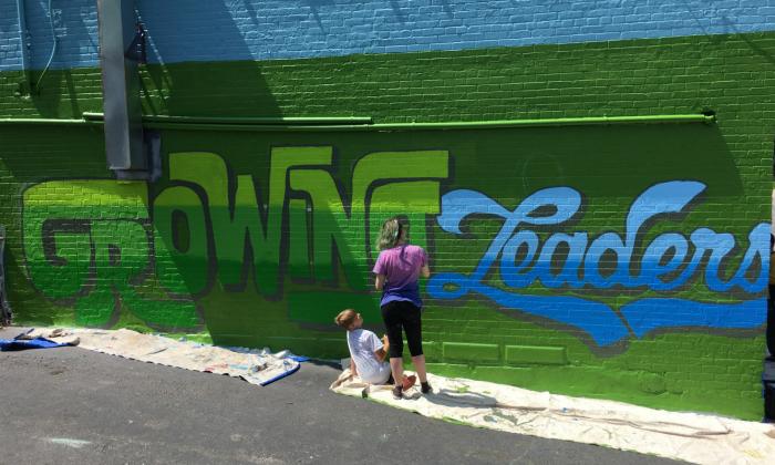 Students in front of Growing Leaders mural | TT Grants Spotlight