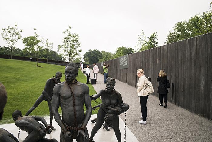 A sculpture commemorating the slave trade greets visitors at the entrance of the National Memorial for Peace and Justice.