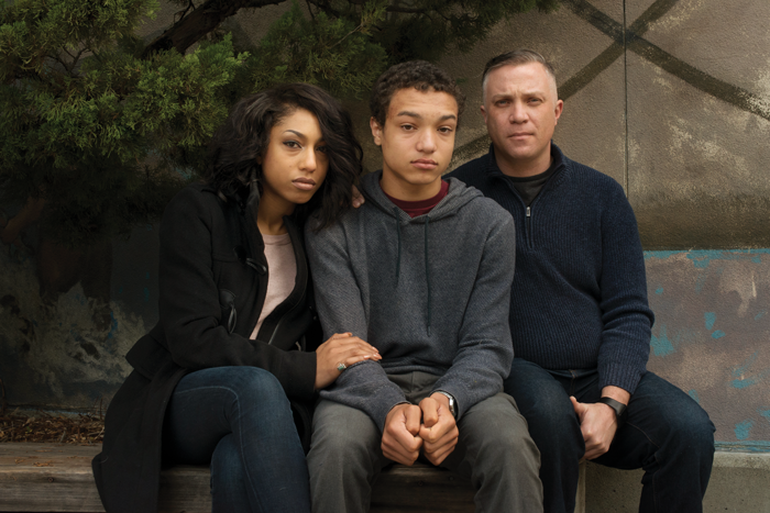 The Mack family sitting together for a photograph.