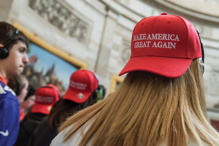 Student wearing hat that reads "Make America Great Again."