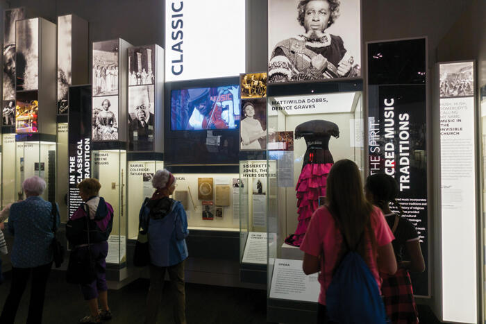 Visitors tour the National Museum of African American History and Culture.