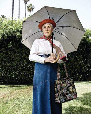 Lila Lee Silvern with an umbrella and handbag