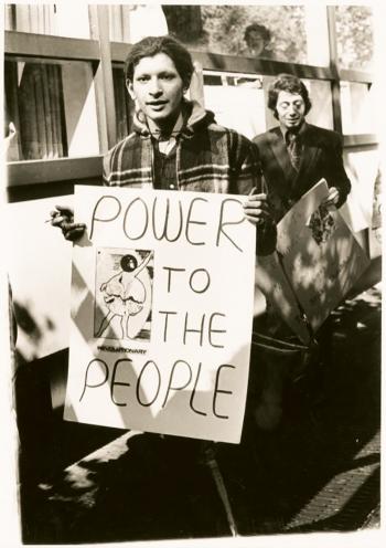 Sylvia Rivera holding sign that reads "Power to the People"