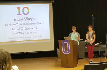 Student presenting a slide titled "10 Easy Ways to Make Your Classroom More LGBTQ-Friendly and Why It Matters."