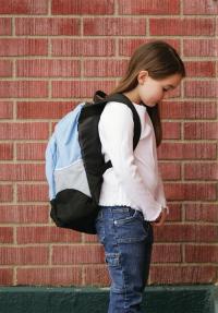 Photo of young girl with head down