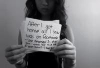 Screenshoot of youlg girl holding a message about bullying 