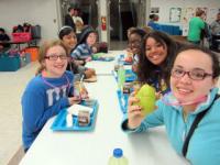 Students with Glow-in-the-dark necklaces enjoying lunch